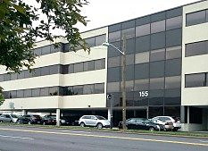 The office building at 155 Polifly Road in Hackensack, seen from the street.