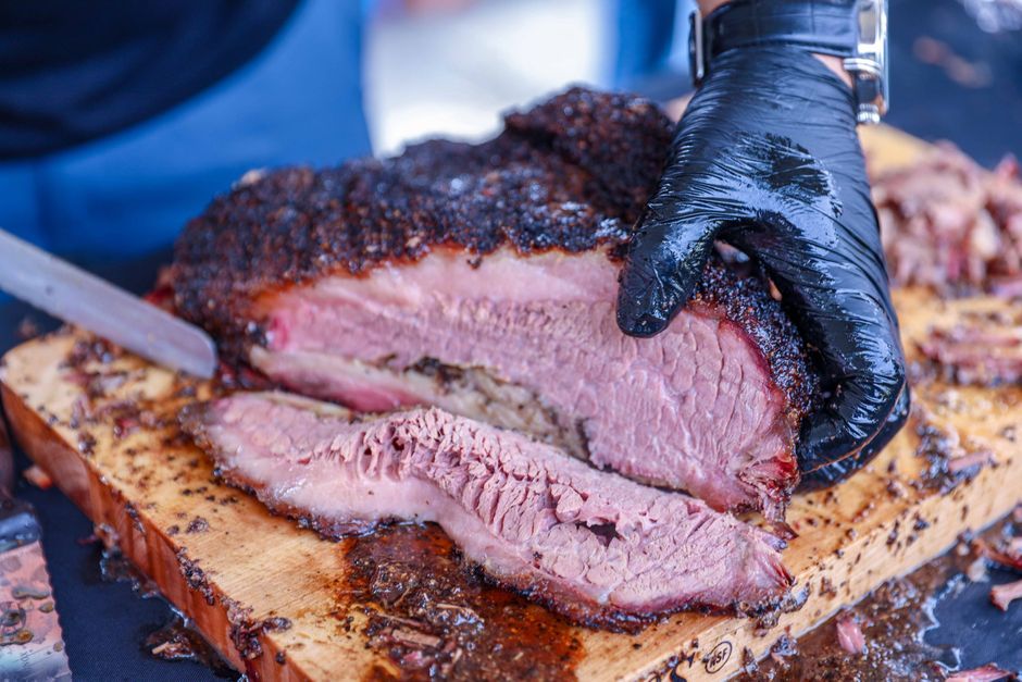 Brisket — Beef brisket smoked low and slow until it slices tender.