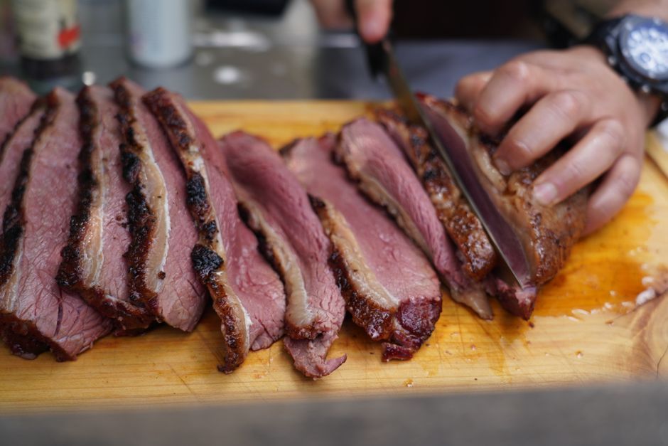 Brisket — Beef brisket smoked low and slow until it slices tender.