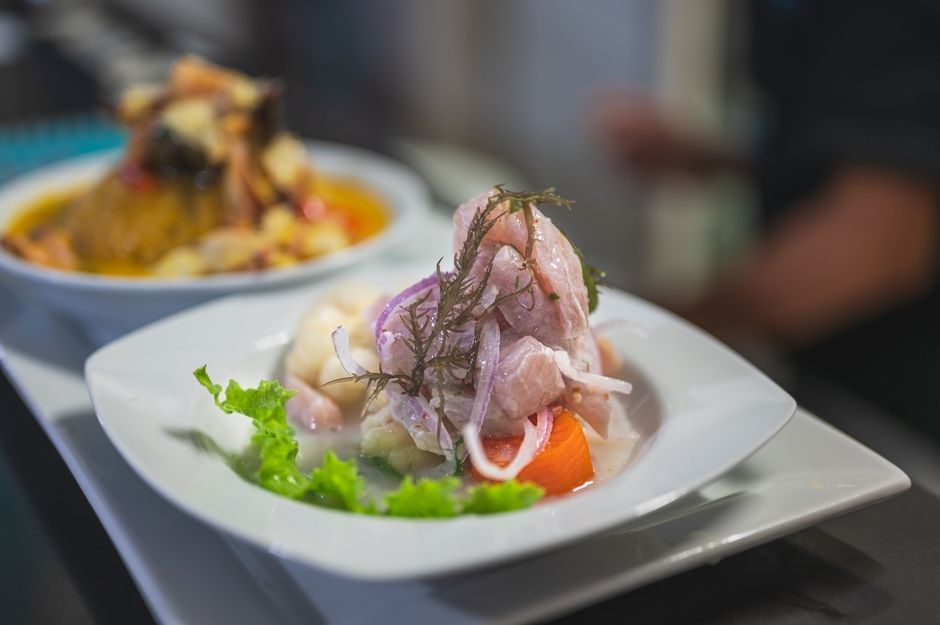 Ceviche — Raw fish cured in citrus juice with onion and chilli.