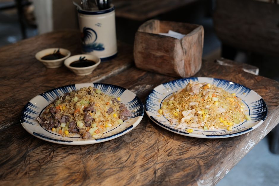 Fried Rice — Wok-fried rice with egg, vegetables and soy seasoning.