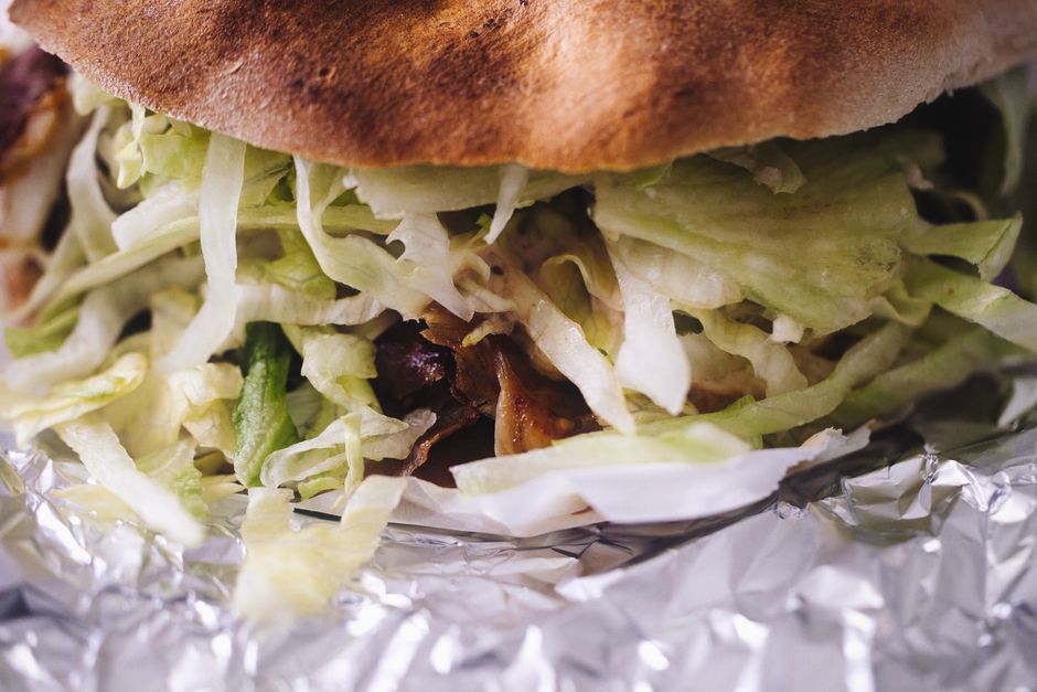 Gyro — Spit-roasted meat in pita with tomato and yoghurt sauce.
