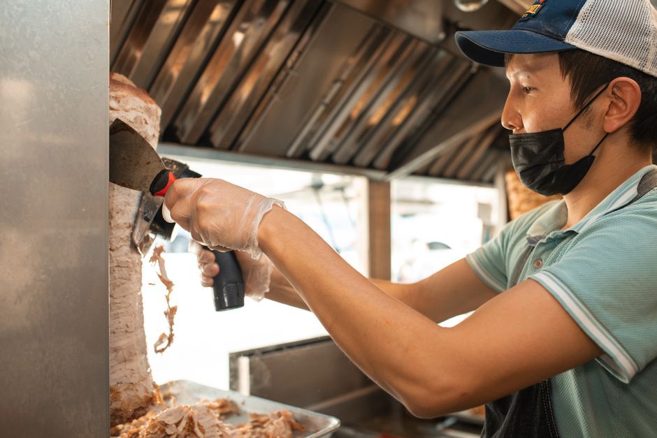 Gyros — Spit-roasted meat in pita with tomato and yoghurt sauce.